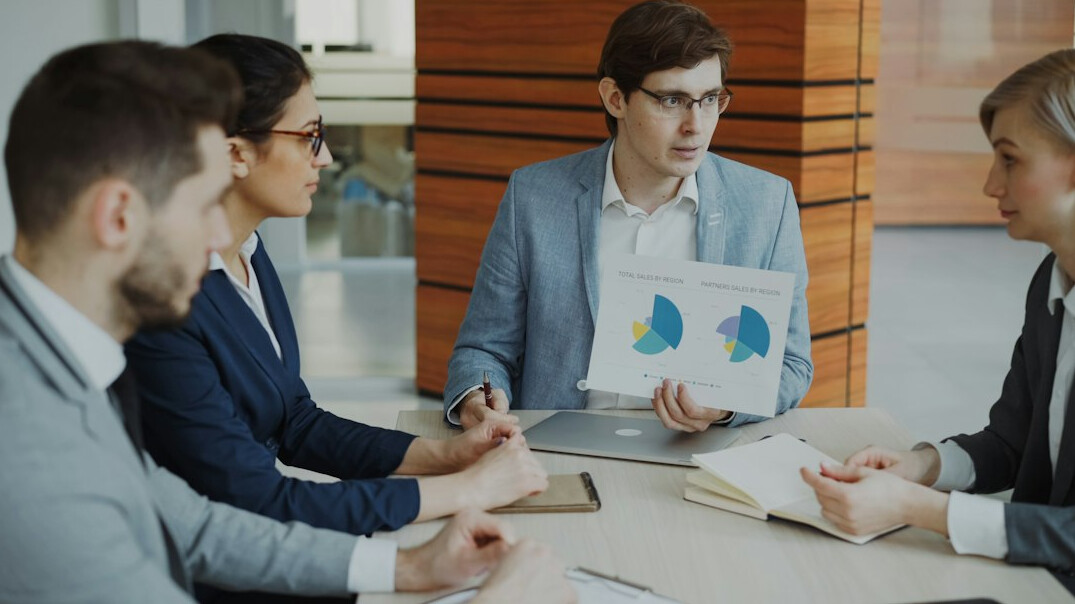 business team meeting with charts